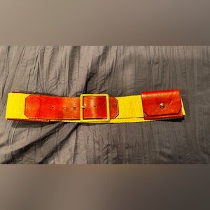 Vintage Yellow and Brown Belt with‎  two pouches.
Measures 30 inches.